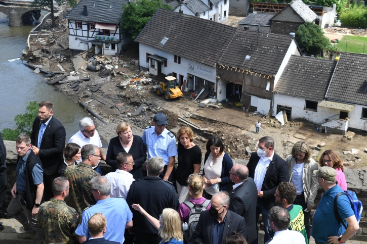 Merkel tours ‘surreal’ flood scene, vows aid, climate action