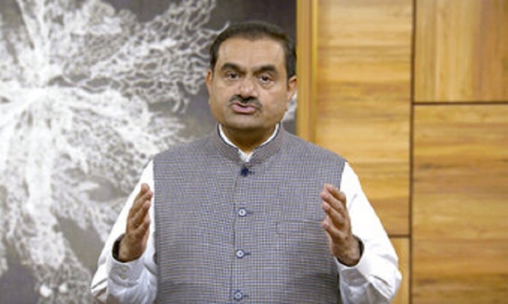 Indian tycoon Adani hit by more losses, calls for probe