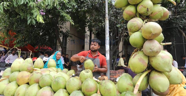 In Photos: People drinking coconut water amid blazing heat