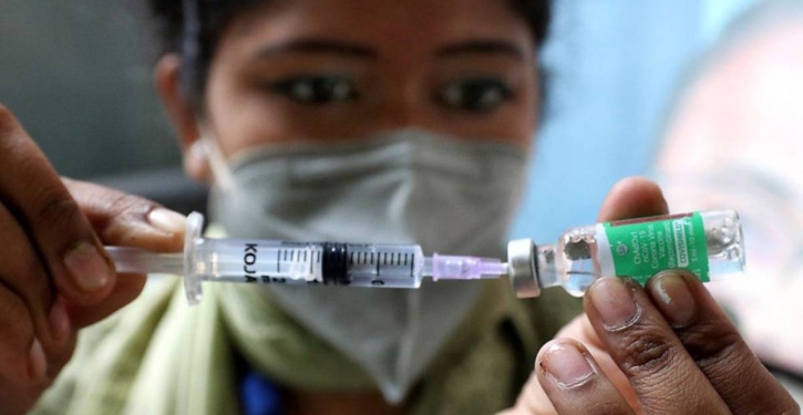 Top vaccine maker, sitting on huge stockpile, halves production Top vaccine maker, sitting on huge stockpile, halves production