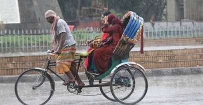 In photos: Rain drenches Dhaka