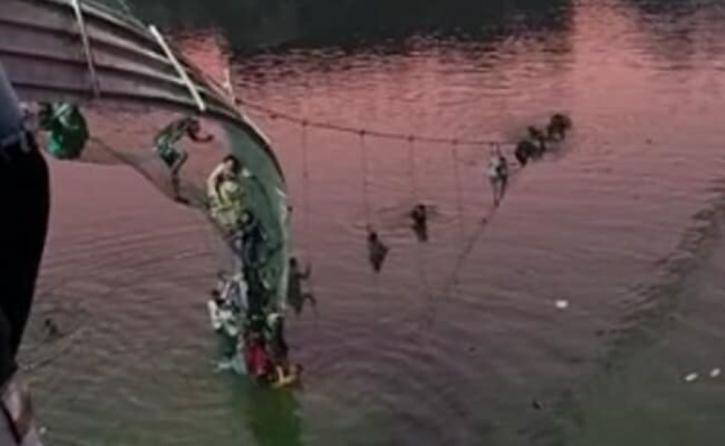 Hundreds plunge into river after India bridge collapses Hundreds plunge into river after India bridge collapses