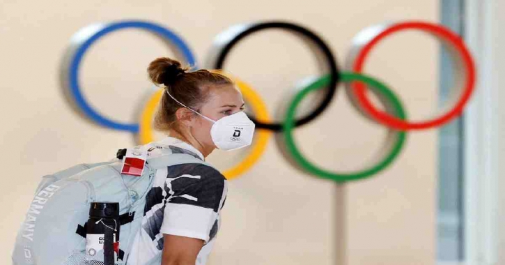 Tokyo Olympics begin with muted ceremony, empty stadium