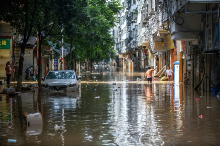 Record floods threaten southern China