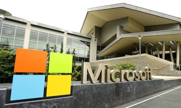 Microsoft reports boost in profits, revenue, as it pushes AI