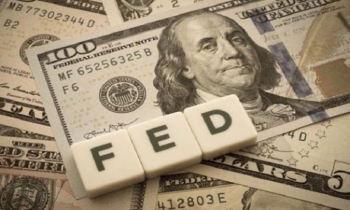 Asian markets sink, dollar gains as Fed hints at further rate hike