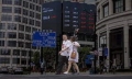 Asian markets struggle as traders prepare for higher rates