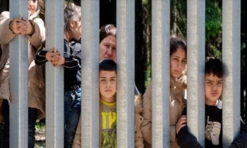 Migrants with children stuck at Poland’s border wall; activists say Belarus won’t let them turn back