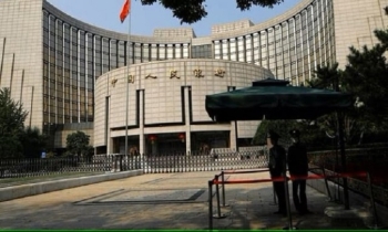 China central bank cuts benchmark lending rate to boost economy