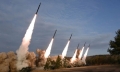N. Korea’s Kim oversees ’super-large’ rocket launcher drills