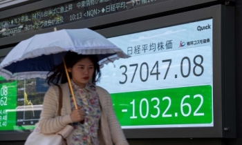 Asian markets mixed as traders pause ahead of US inflation data