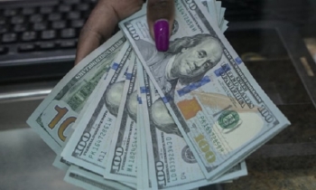 Dollar weakens further as rate cut bets build, but equities mixed
