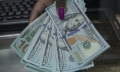 Dollar weakens further as rate cut bets build, but equities mixed